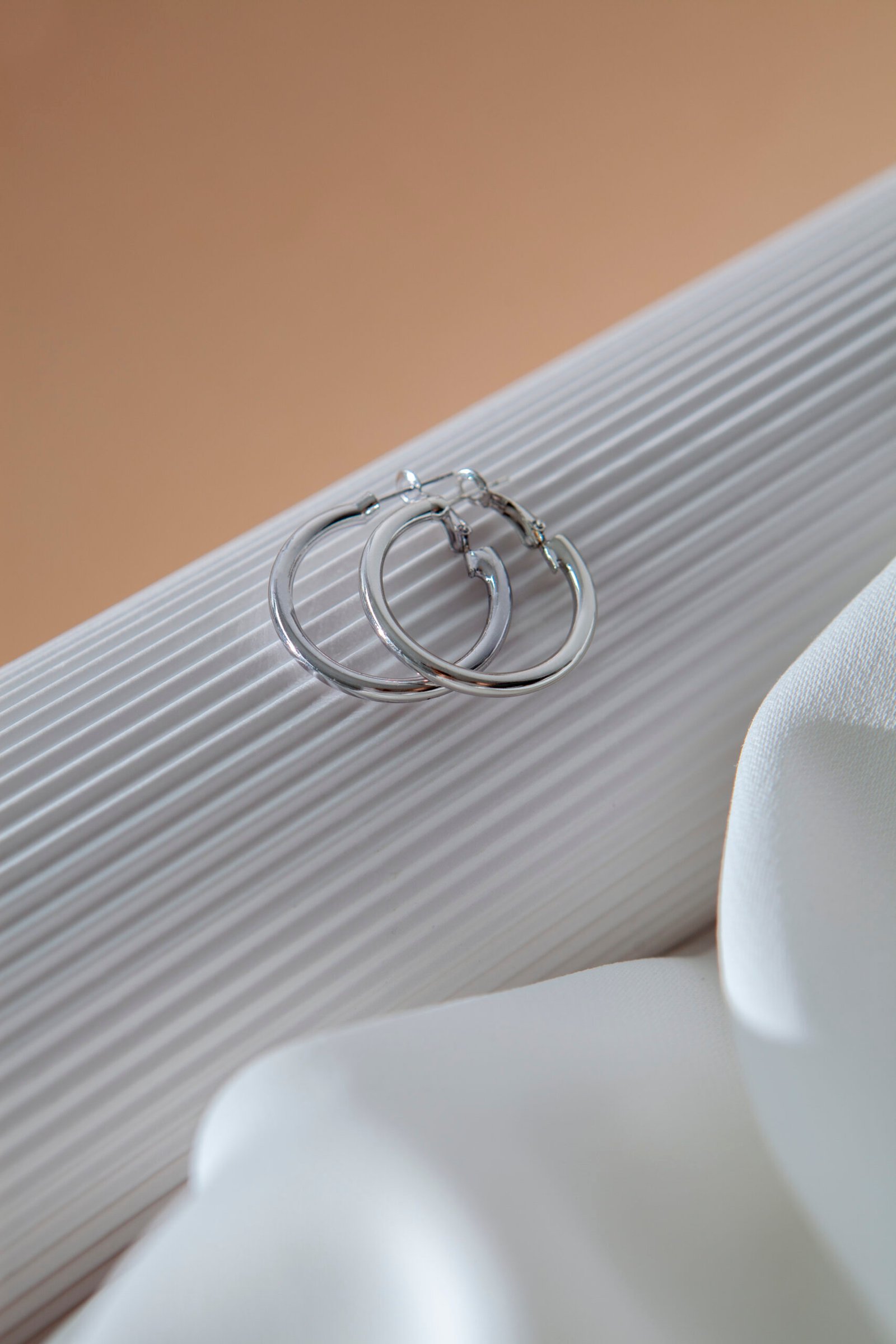 aesthetic silver earrings arrangement